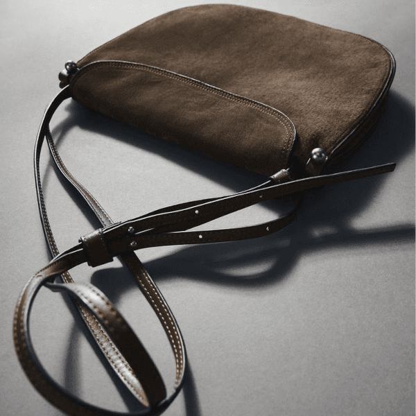 Flat-lay product image of a handbag uploaded to myAIwear